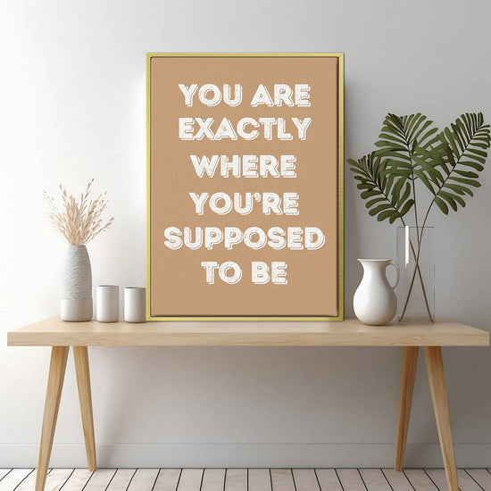 gold frame motivational poster canvas print on the table