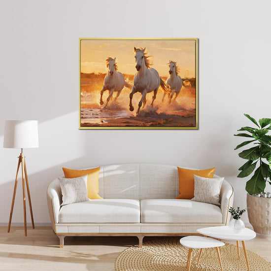 gold frame wall art painting of three galloping white horses hanging on the wall in the simple and elegant living room