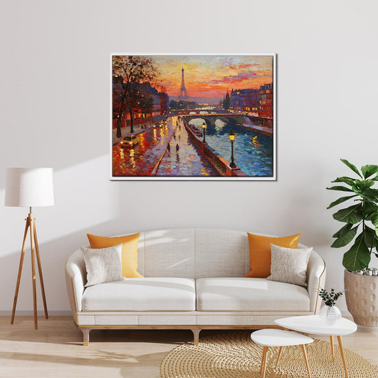 white frame wall art painting depicting the beautiful sunset scenery of the Seine River in Paris hangs on the wall of the living room