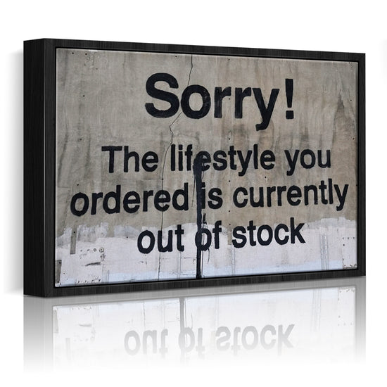 banksys statement canvas print black frame