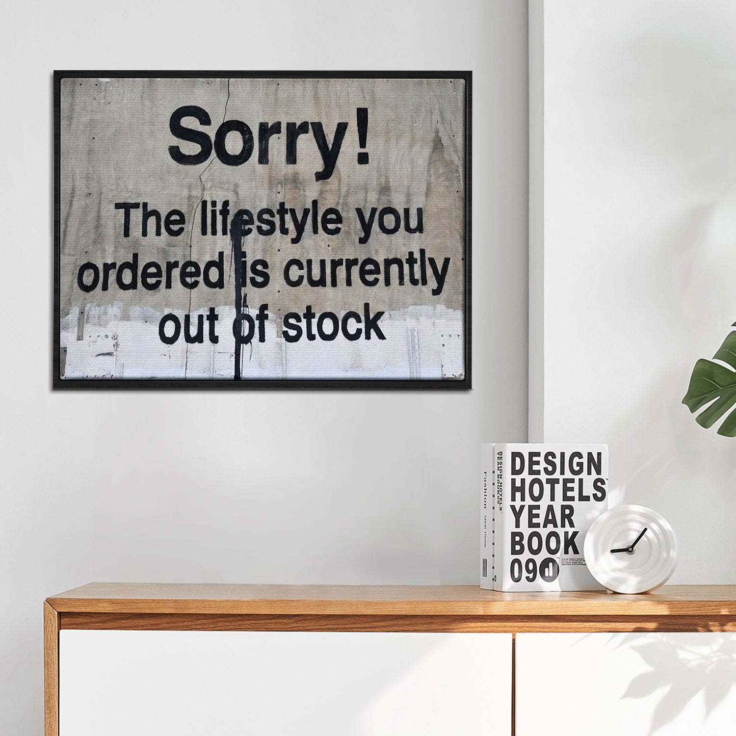 black frame banksys statement canvas print in the living room