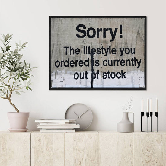 black frame banksys statement canvas print in the living room