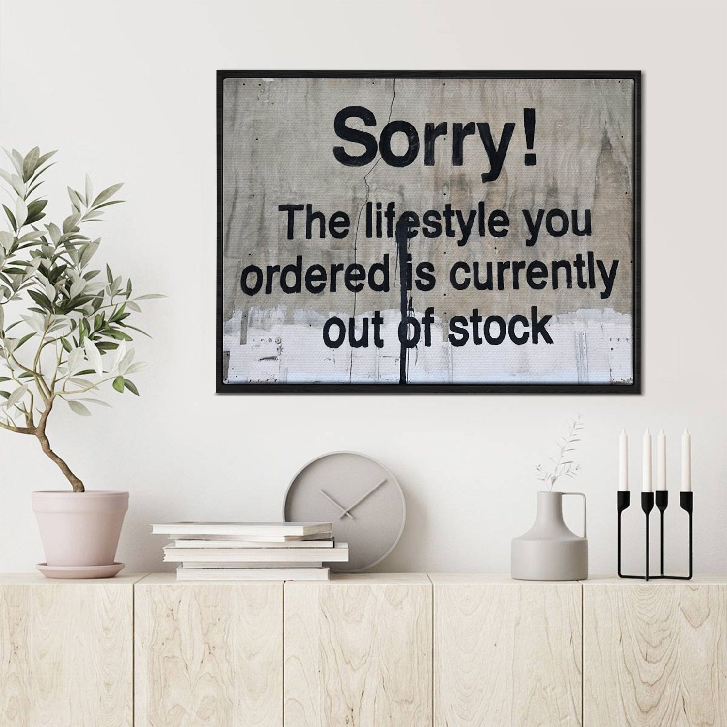 black frame banksys statement canvas print in the living room