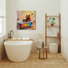 wall art canvas in the bathroom depicts a brown bear taking a bath in a colorful bathtub