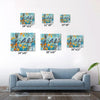 different size wall art canvas showing two bluebirds perched on a branch.