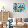 wall art canvas in the living room showing two bluebirds perched on a branch.