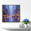a coffee frame wall art painting showing the bustling city streets on a rainy night hangs on the wall of a warmly decorated room