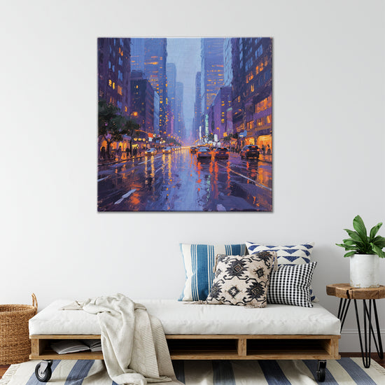 a wall art painting showing the bustling city streets on a rainy night hangs on the wall of a warmly decorated room
