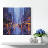a wall art painting showing the bustling city streets on a rainy night hangs on the wall of a warmly decorated room