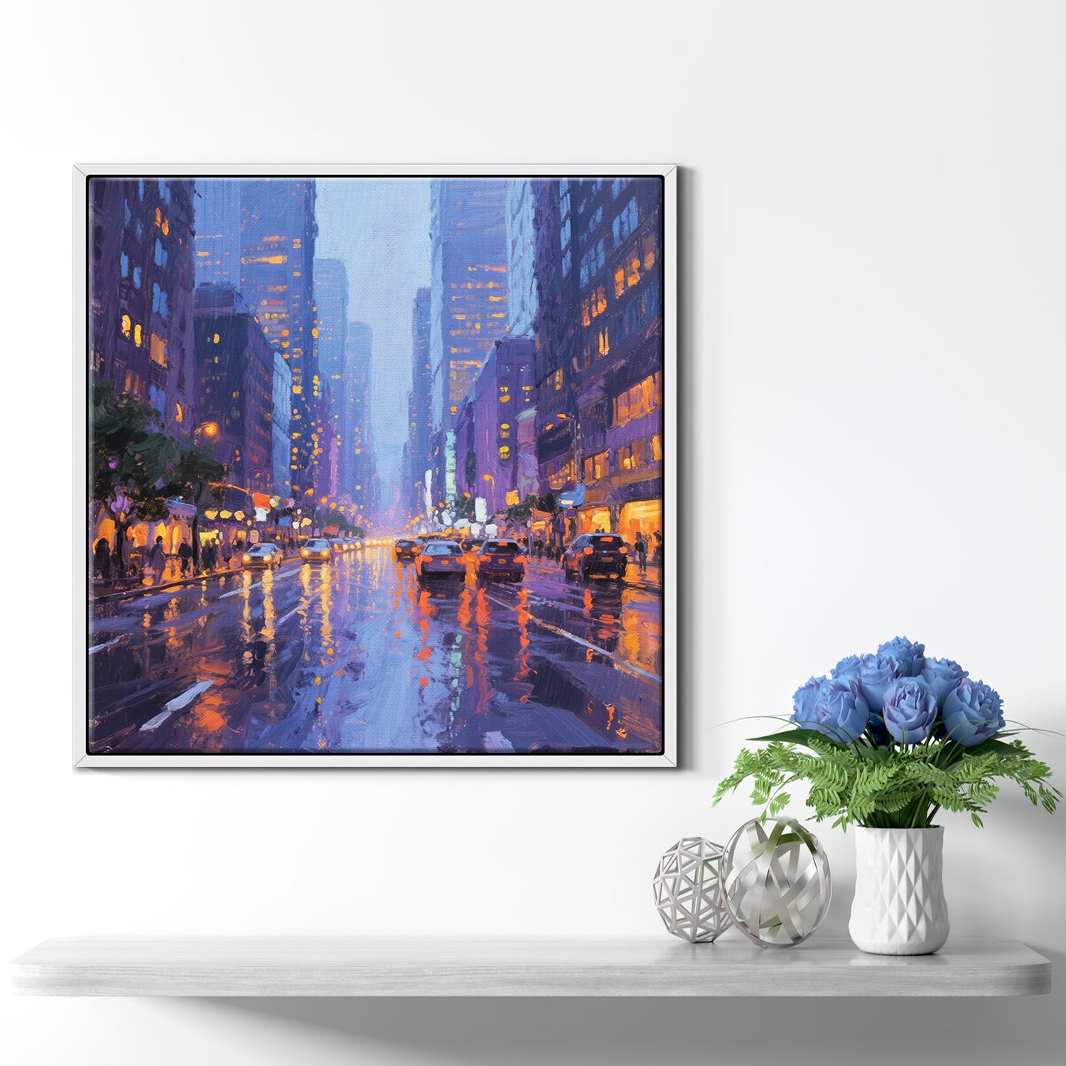 a white frame wall art painting showing the bustling city streets on a rainy night hangs on the wall of a warmly decorated room
