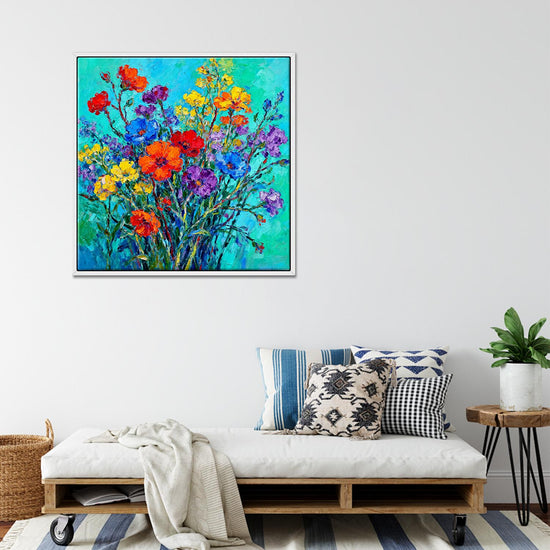 white frame wall art canvas painting depicts a gorgeous and colorful bouquet of flowers.