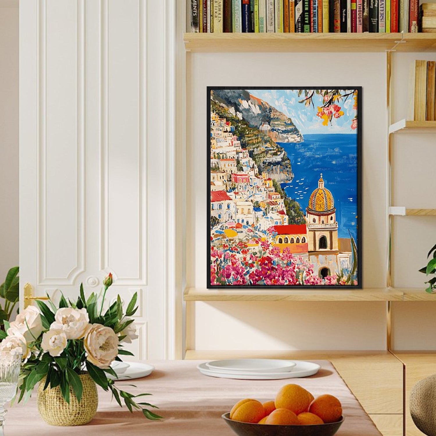 black frame seaside town scenery wall art painting on bookshelf