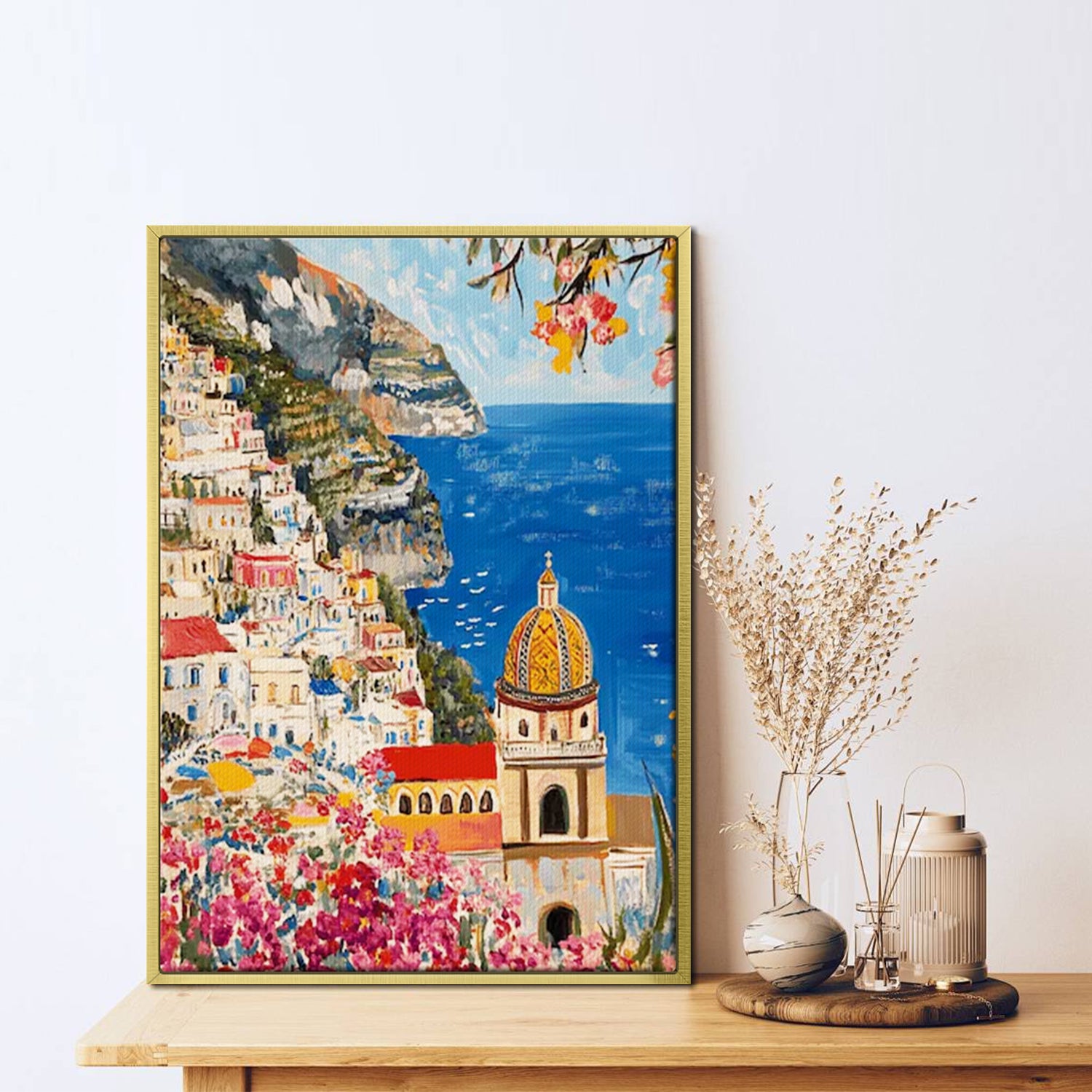 gold frame seaside town scenery wall art painting on the table
