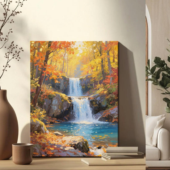 wall art canvas painting on the table depicting the beauty of a waterfall flowing through a colorful forest in autumn