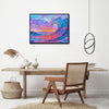 black frame wall art painting above the table depicts the magnificent scene of colorful waves surging.