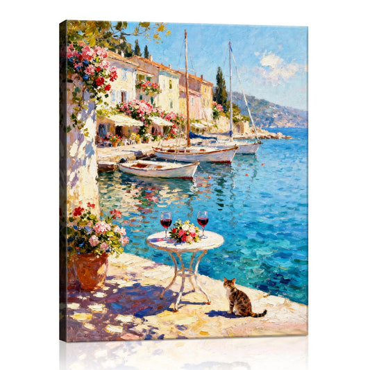 wall art canvas painting showing a sunny seaside town with a table of red wine and flowers on the pier and a cat.