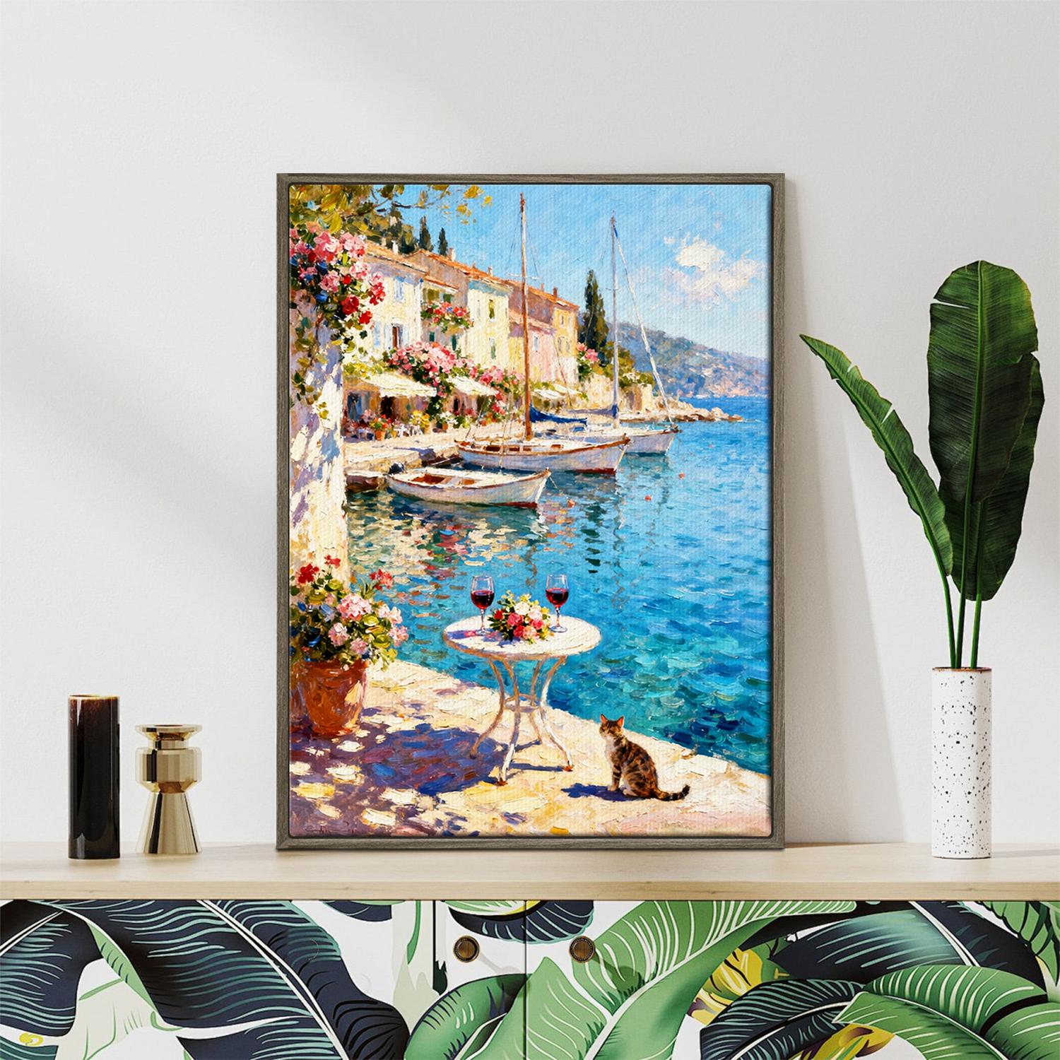 coffee frame wall art canvas painting showing a sunny seaside town with a table of red wine and flowers on the pier and a cat.