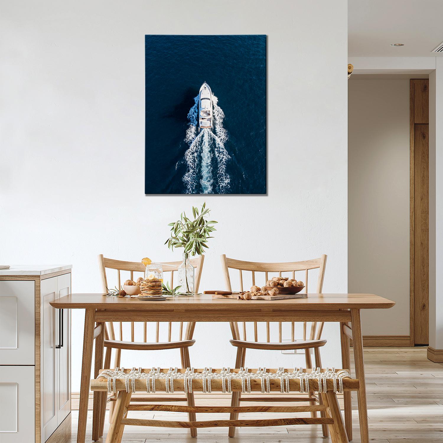 wall art canvas in the dining room depicts a white yacht sails on the deep blue sea