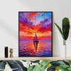 black frame wall art painting depicts the beautiful scenery of a sailboat sailing on the sea dyed by the gorgeous sunset.