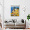 wall art painting in the living room depicting a cliffside cottage by the sea