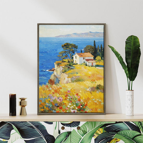 coffee frame wall art painting depicting a cliffside cottage by the sea
