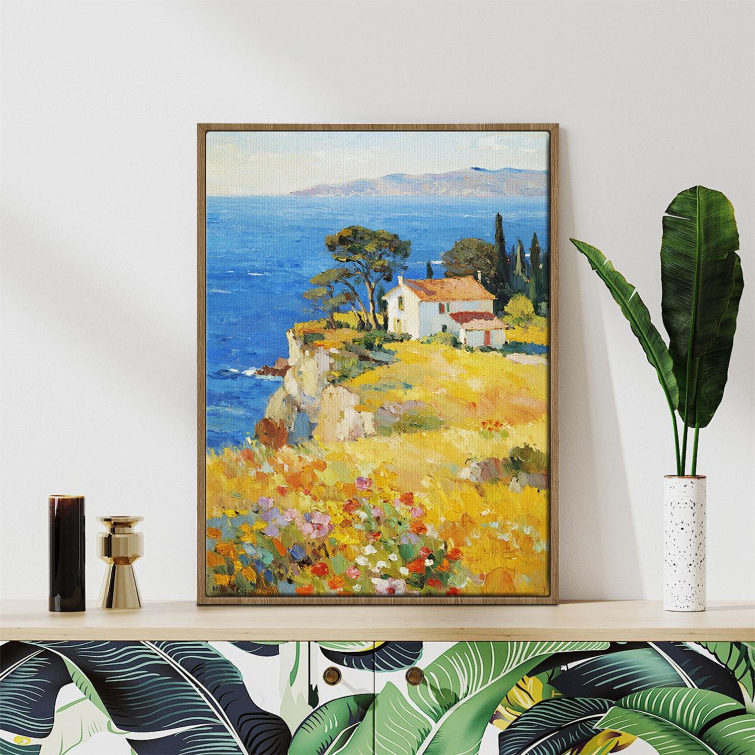 light oak color frame wall art painting depicting a cliffside cottage by the sea