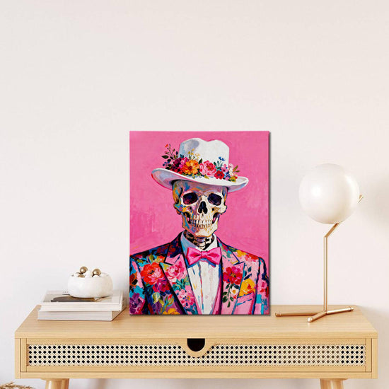wall art canvas on the table depicts skeleton in a suit