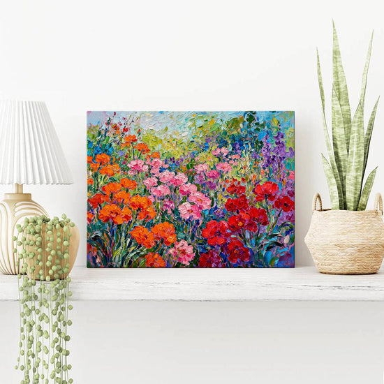 wall art canvas painting on the table depicts a colorful sea of flowers