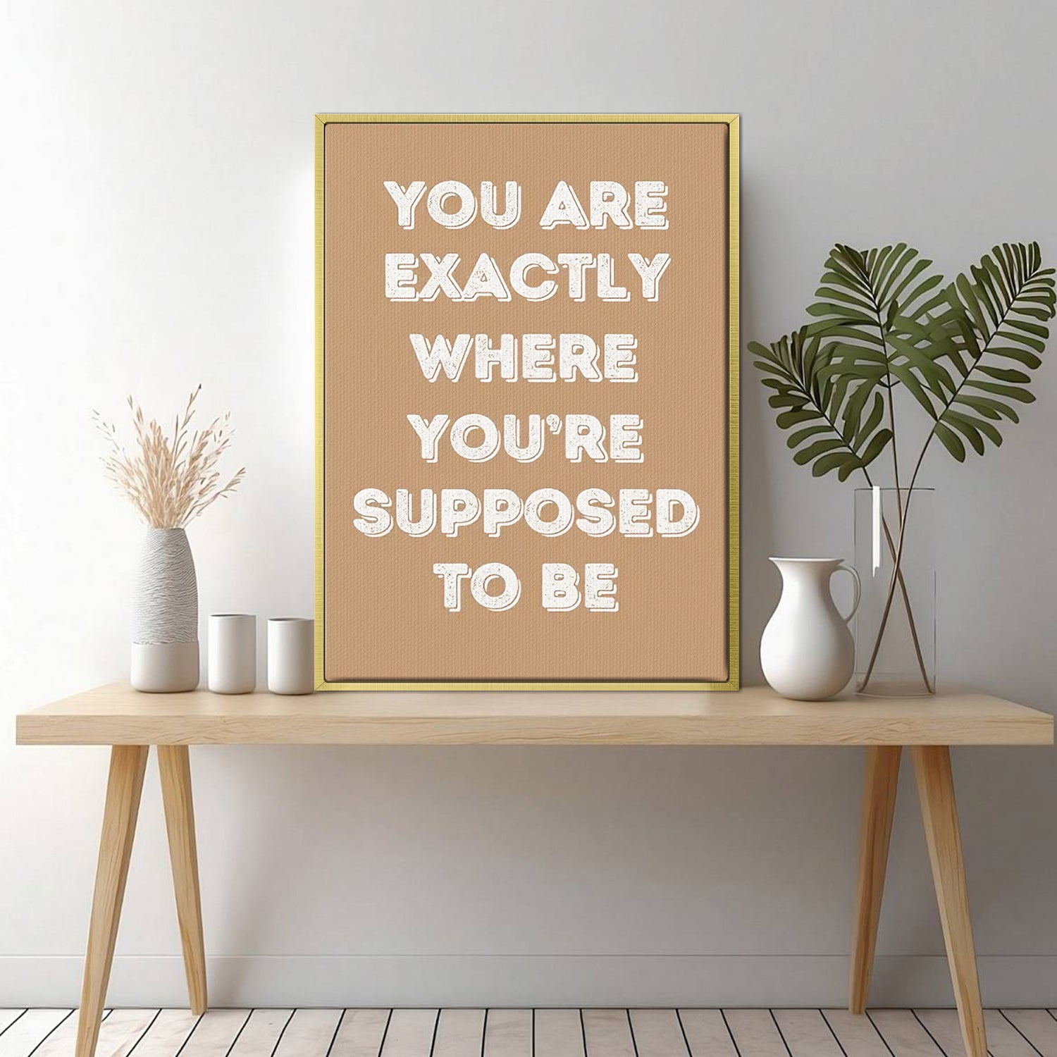 gold frame motivational poster canvas print on the table