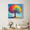 white frame wall art painting shows a colorful rainbow tree