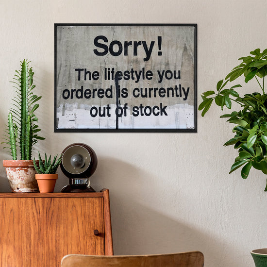 black frame banksys statement canvas print in the living room