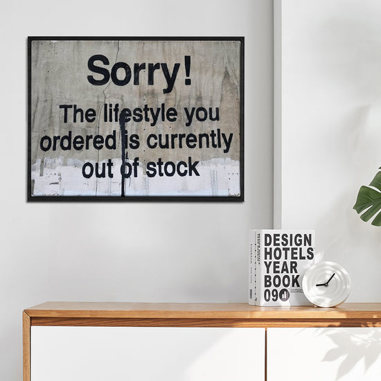 black frame banksys statement canvas print in the living room
