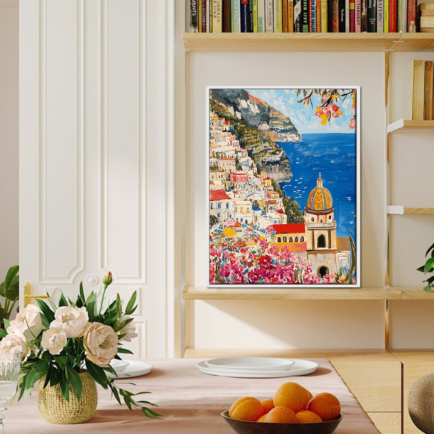 white frame seaside town scenery wall art painting canvas on the bookshelf