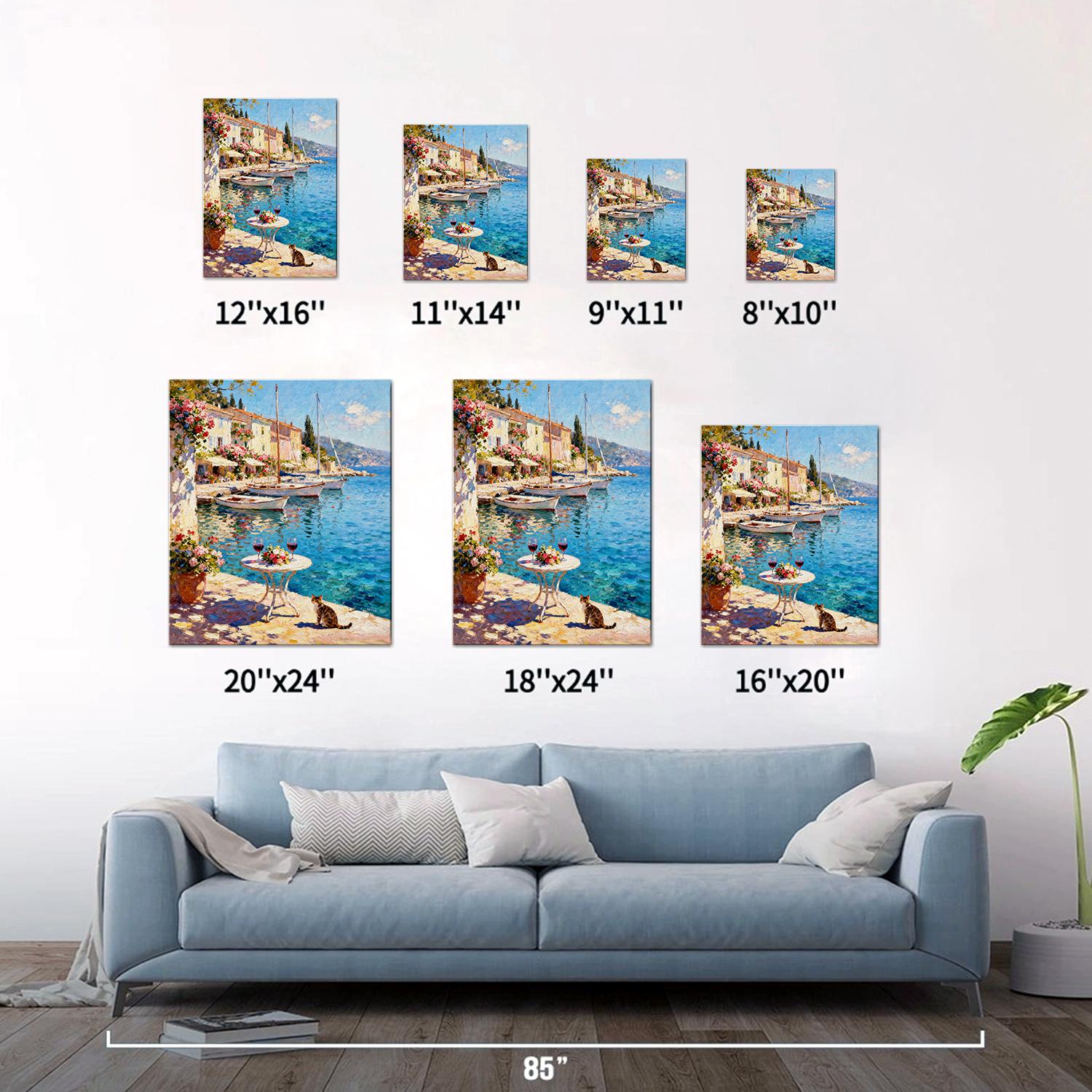 different size wall art canvas painting showing a sunny seaside town with a table of red wine and flowers on the pier and a cat.