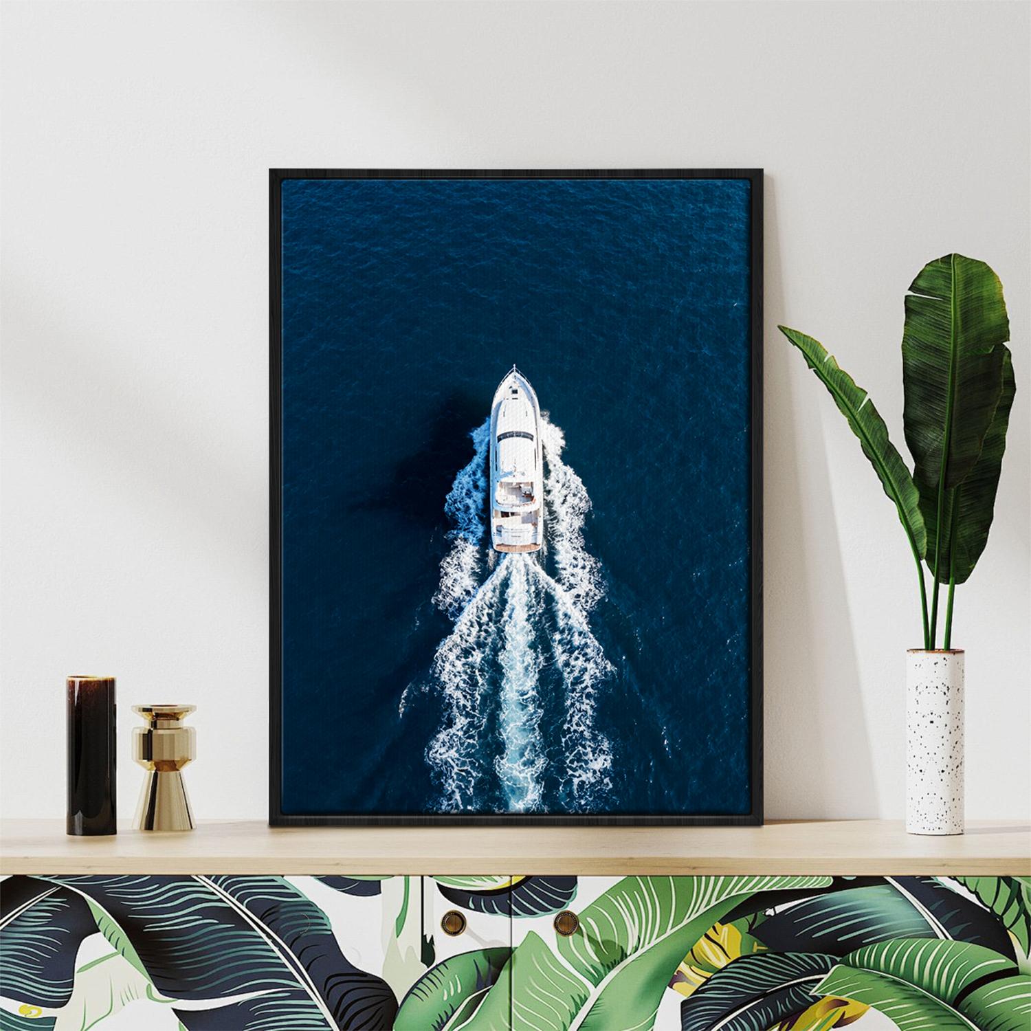 black frame wall art canvas depicts a white yacht sails on the deep blue sea