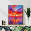gold frame wall art painting depicts the beautiful scenery of a sailboat sailing on the sea dyed by the gorgeous sunset.