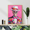 gold frame wall art canvas depicts skeleton in a suit